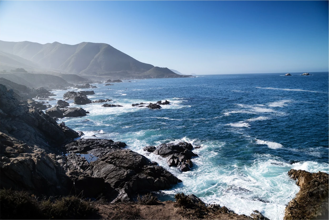 Rocky Pacific coastline with turquoise surf